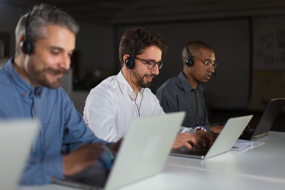 A collaborative team in a bright Toronto office receiving professional IT consulting from The Support Source to prevent business downtime